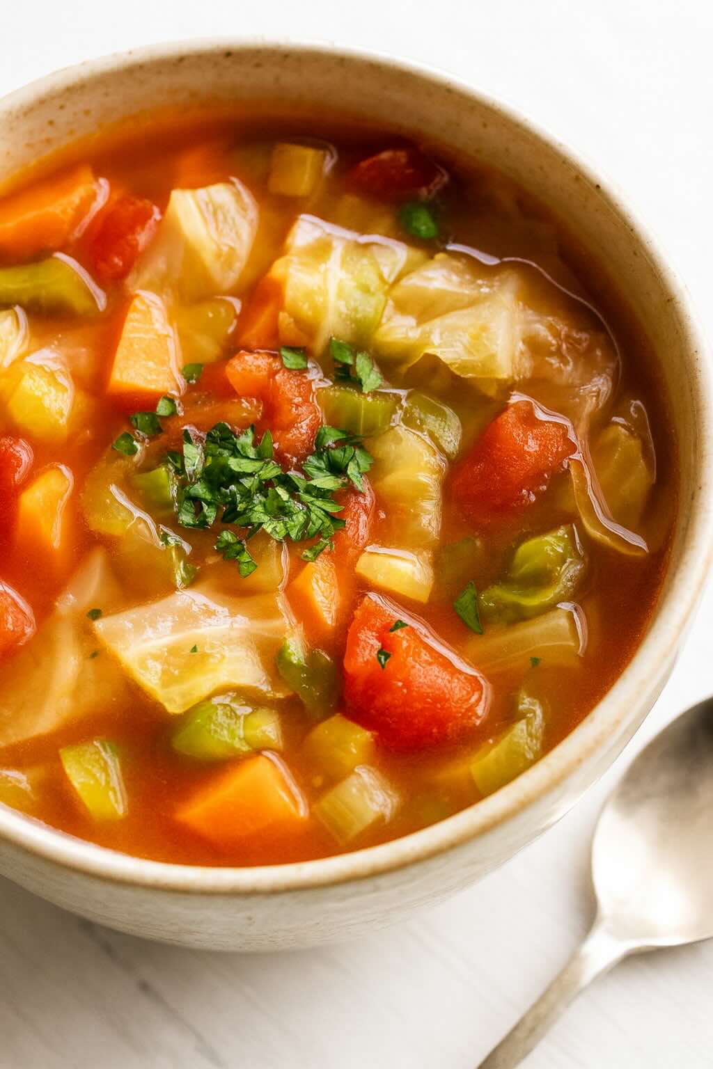 Simple cabbage soup for weight loss with vegetables and parsley